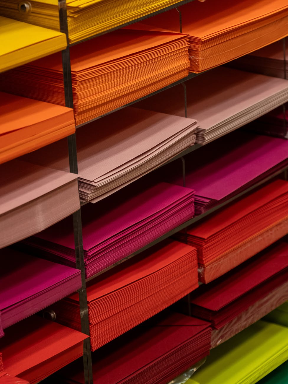 colorful paper stacks in office supplies store